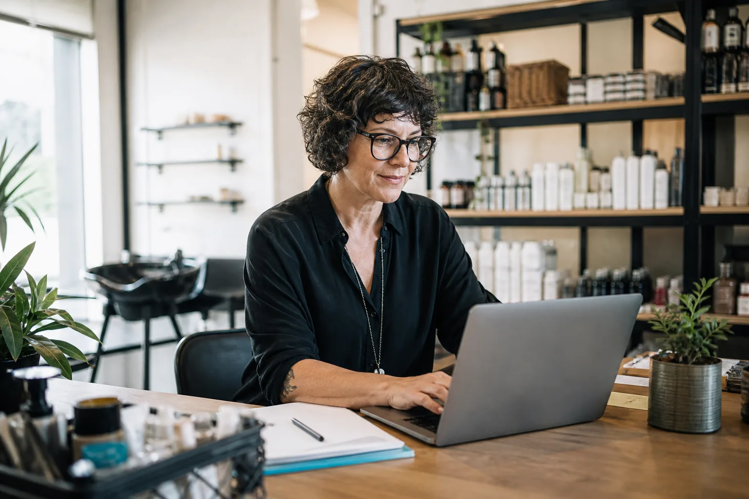 Small business owner confidently using AI tools on a laptop