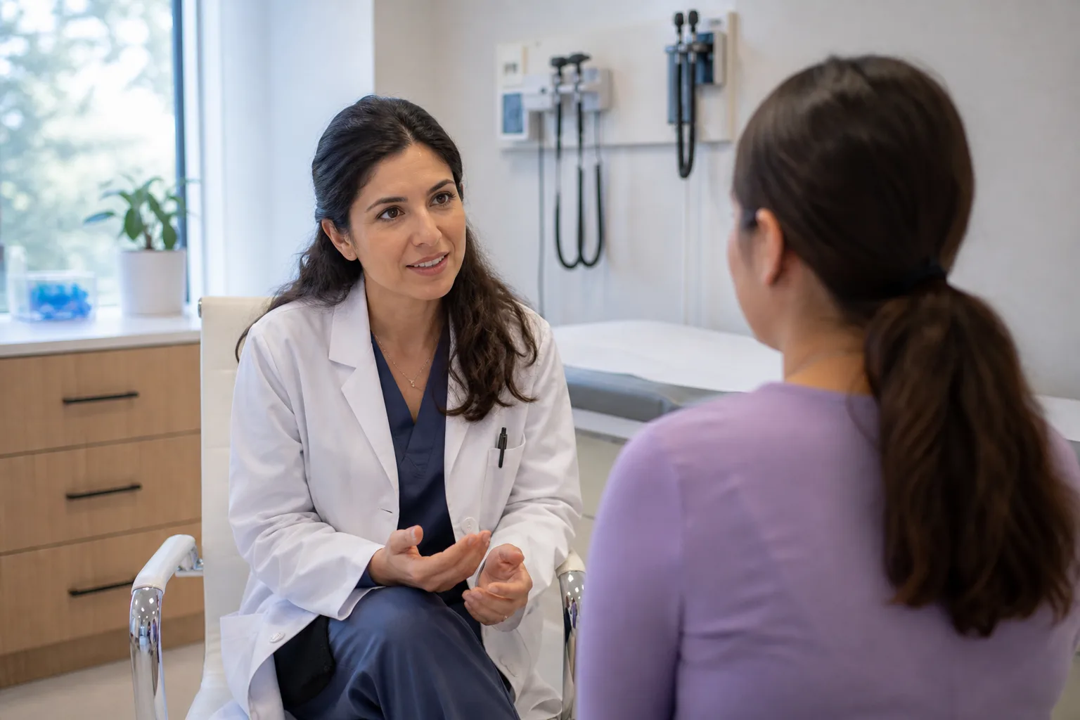 Doctor consulting with a patient in a women's health clinic